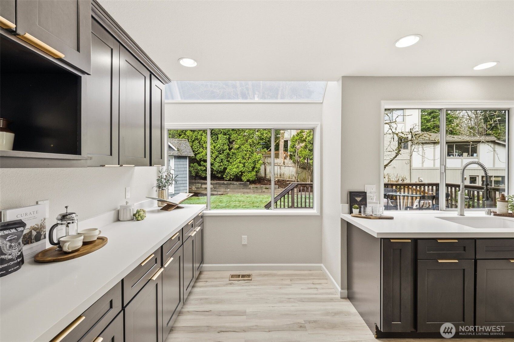 Sunlit breakfast nook with backyard views
