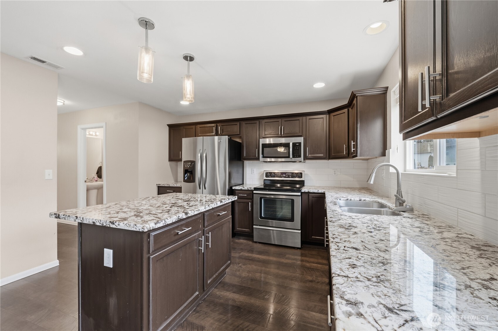 Stainless appliances complement the modern design.
