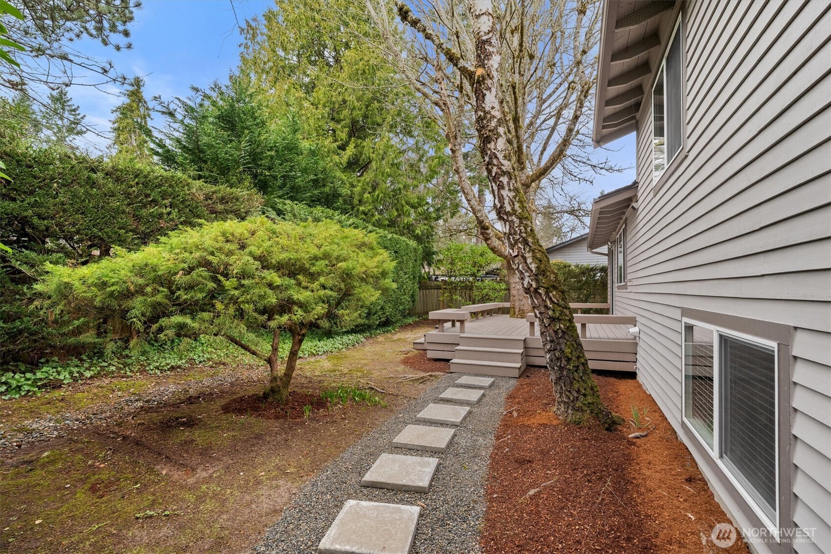 Stepping stones take you through a lush and beautiful backyard.