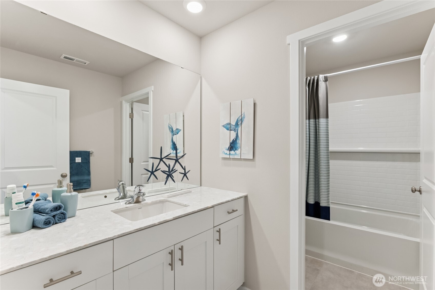 Upstairs hall bath with a separate wet area so two people can use the bathroom at the same time.  Picture for representational purposes only, colors and features may vary.