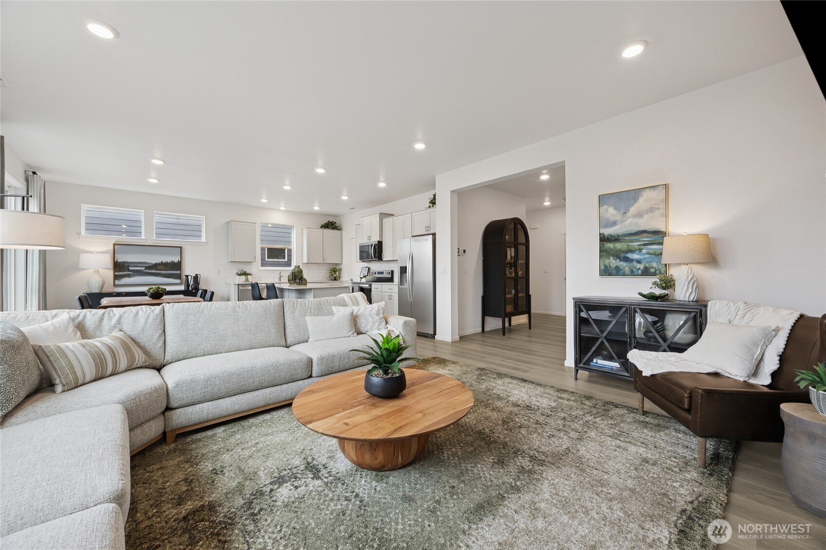 Great room design open to the kitchen and eating area.  Picture for representational purposes only, colors and features may vary.