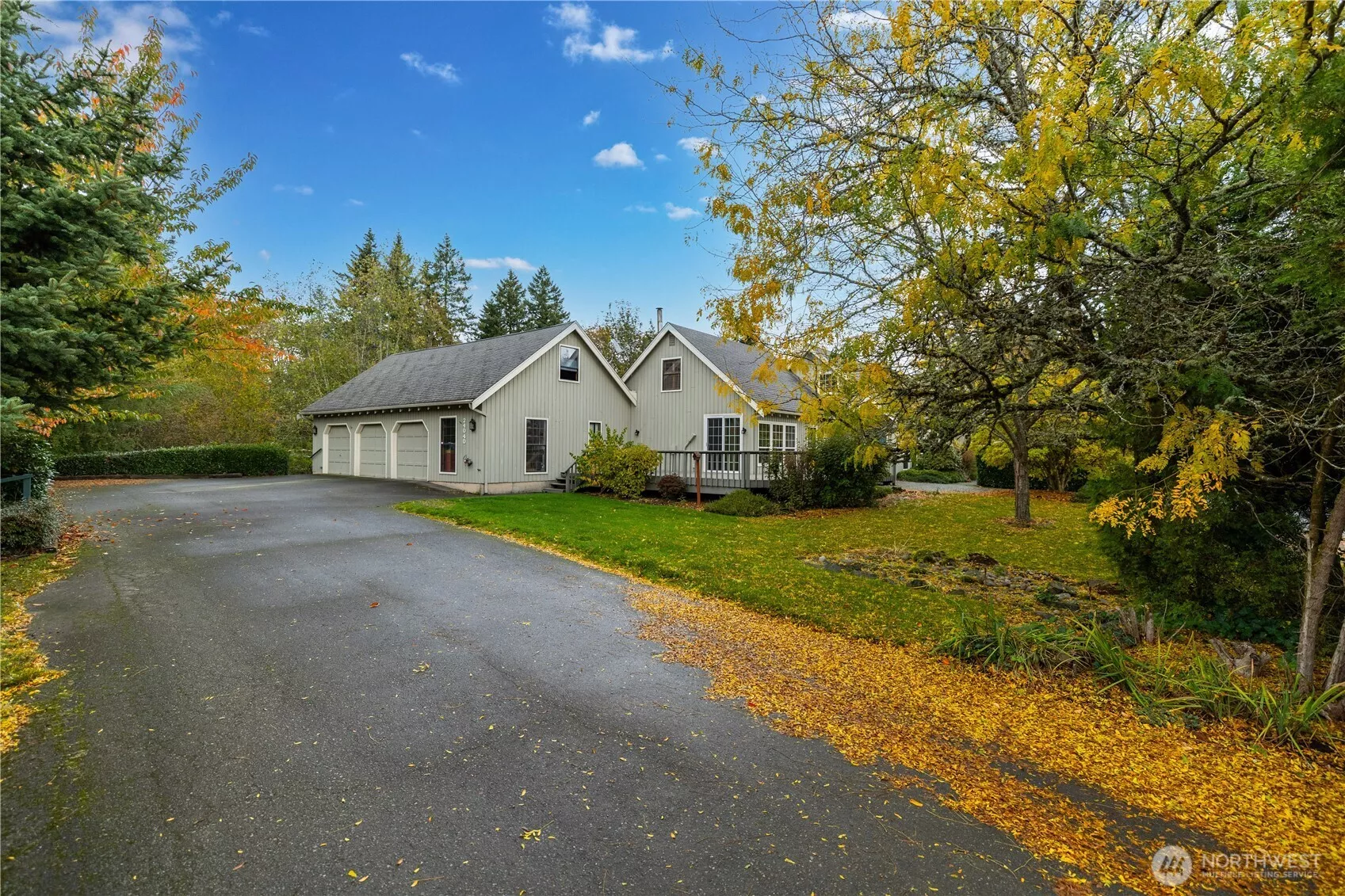 Private driveway leading to the three-car garage.
