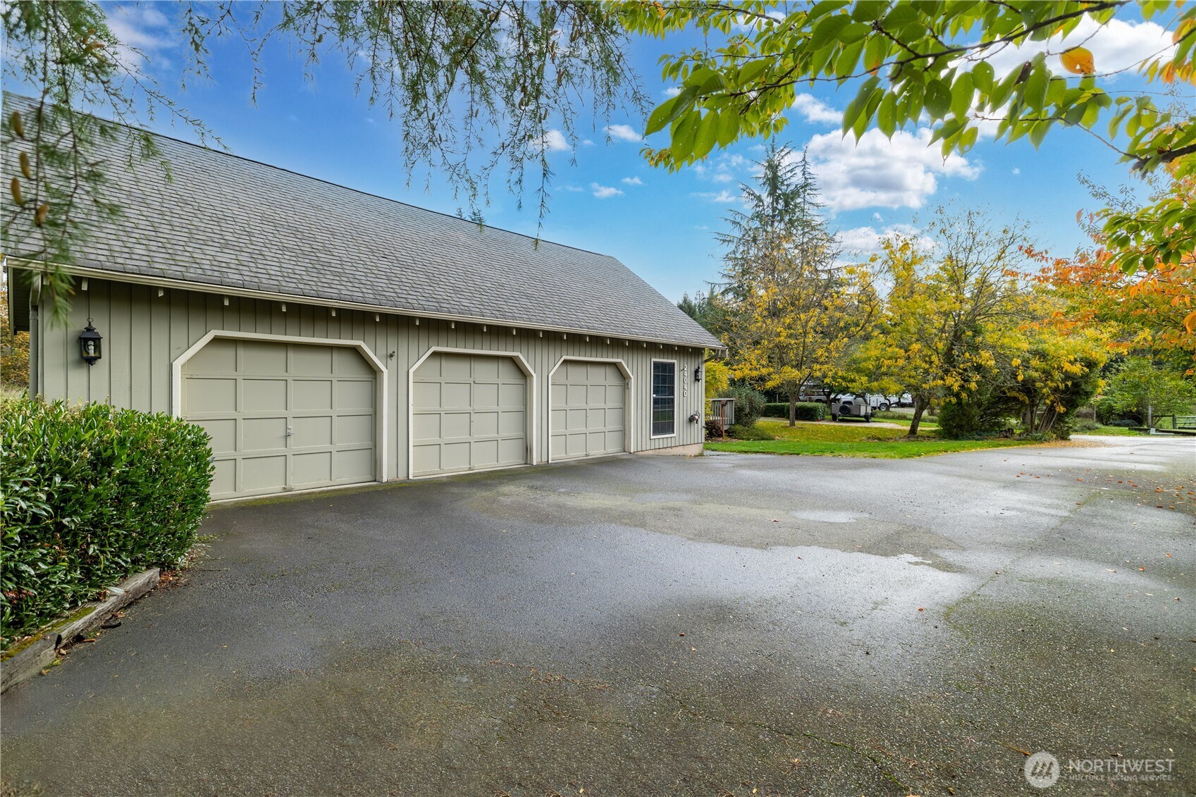 Three-car garage with ample parking space.