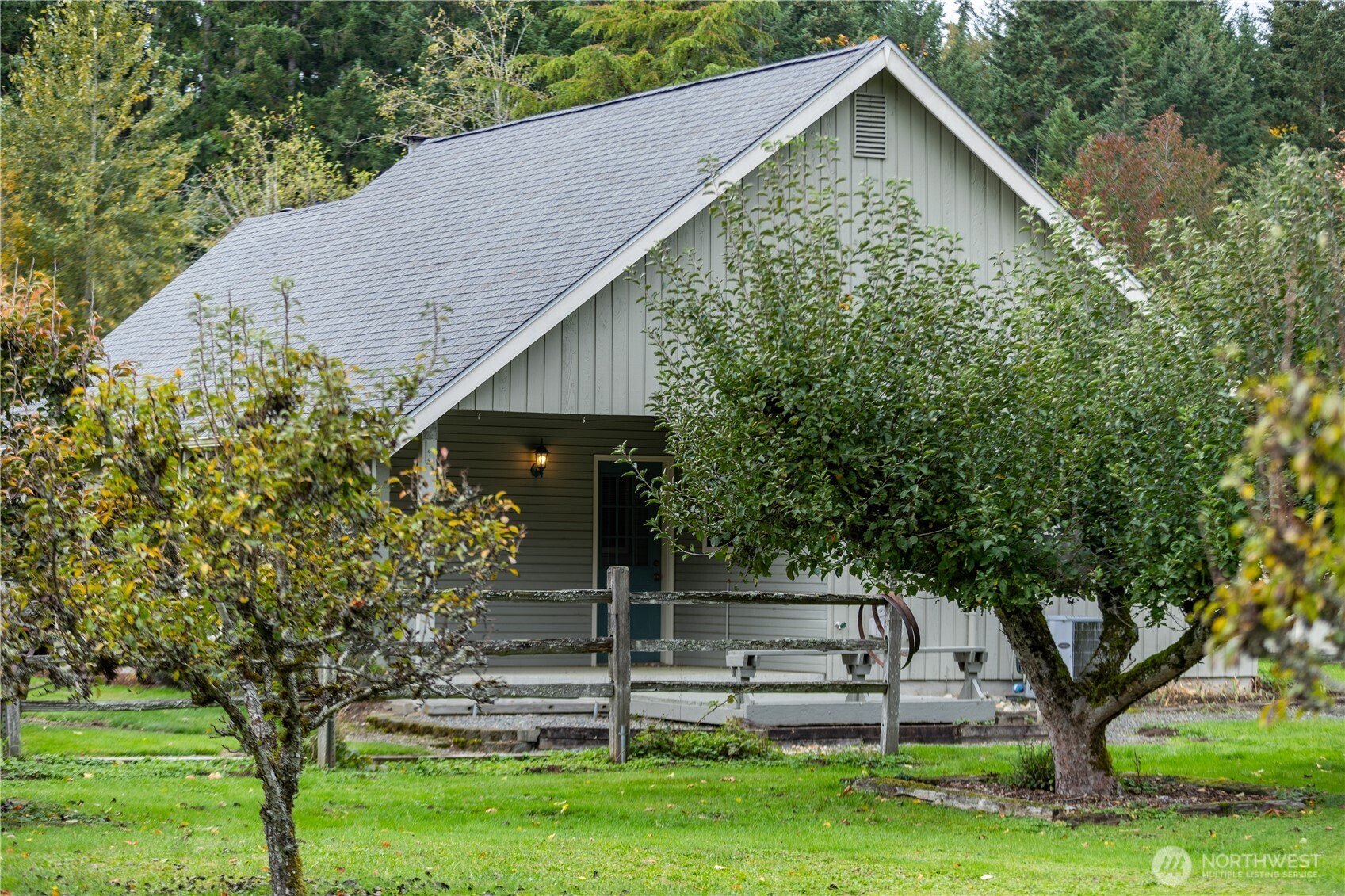 Mature trees frame the property for privacy.