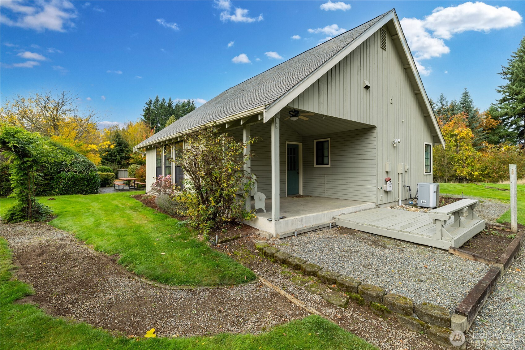 Covered porch area for extended outdoor living.