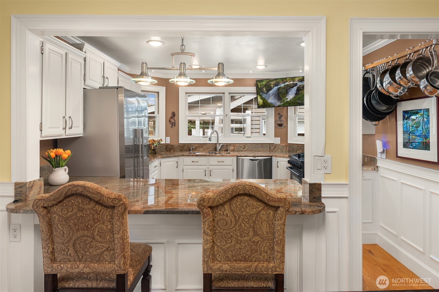 Primary Suite with shiny Swedish flooring, vaulted ceilings, customized closet with jewelry drawer, and built-ins.