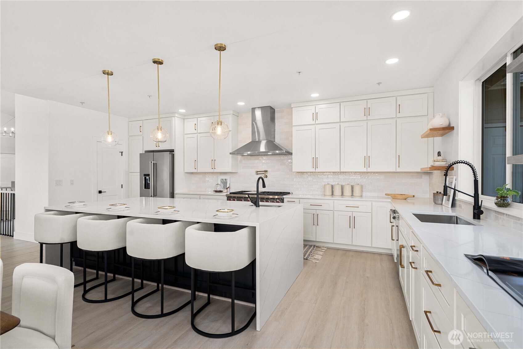 The reimagined chef’s kitchen serves as a stunning centerpiece