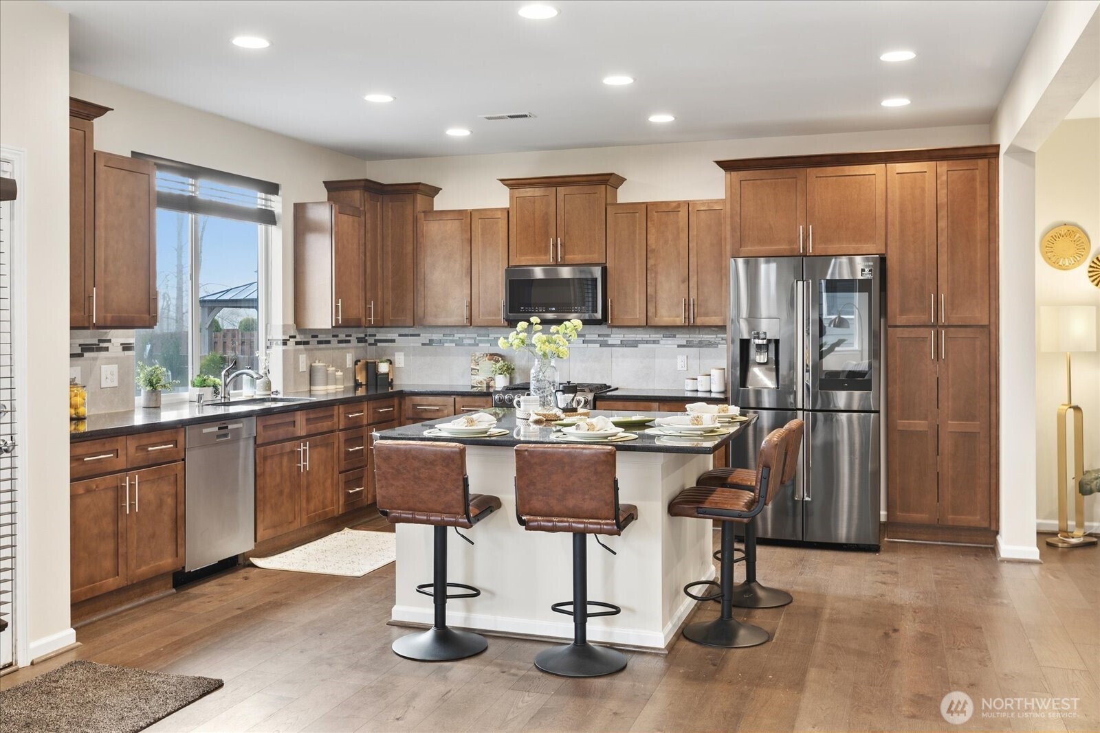 Modern kitchen offers amble counter space and cabinet storage.
