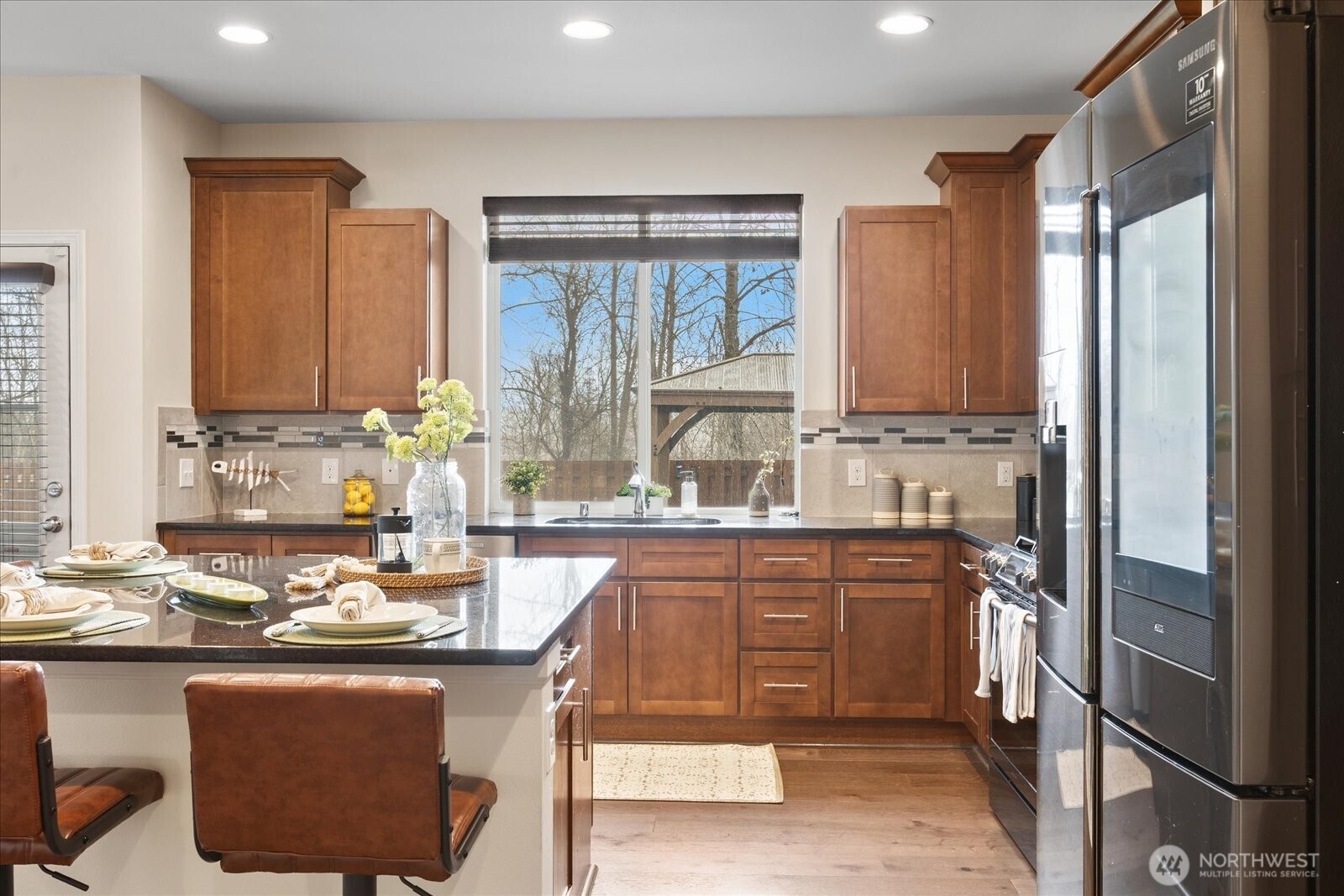 Stainless steel appliances with smart fridge.