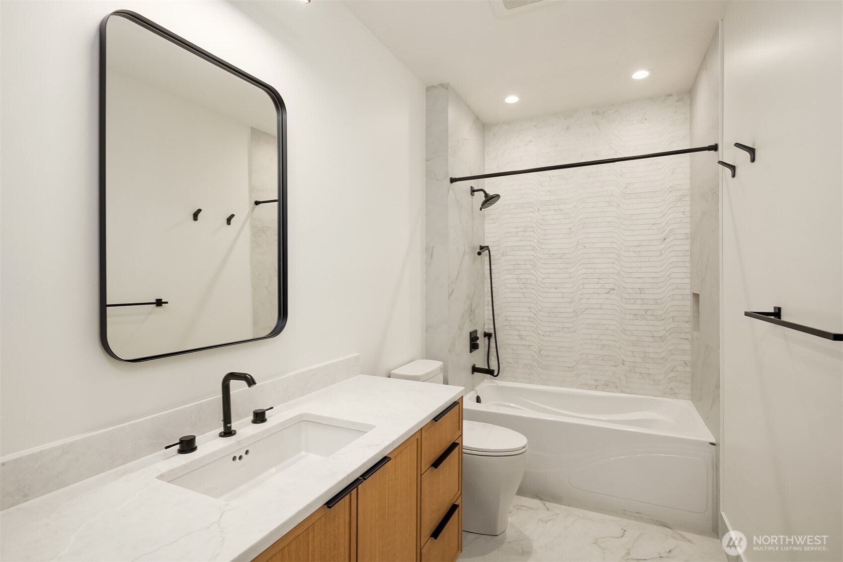 Hallway full bathroom completes the lower level.