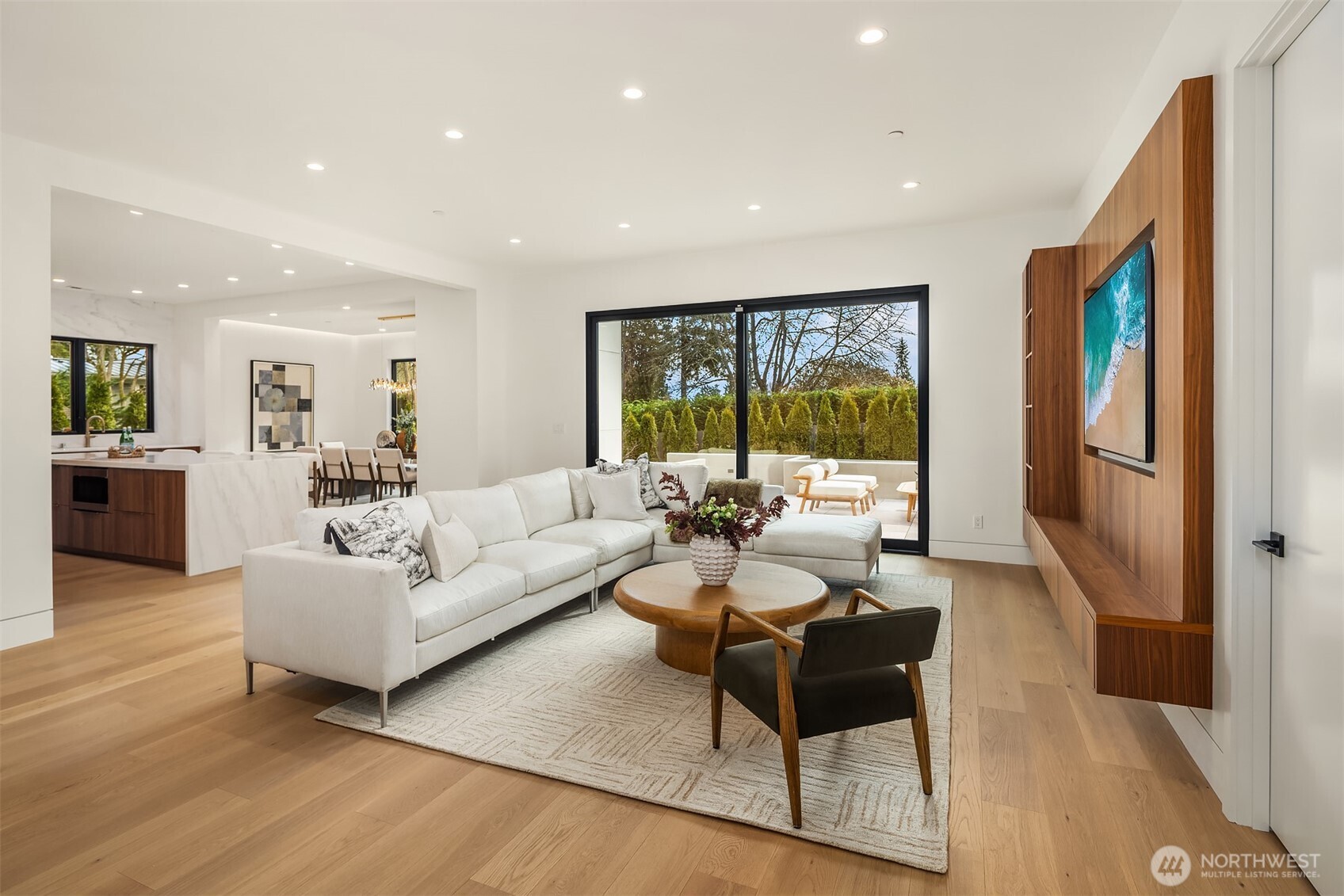 The main level flows seamlessly from room to room, bathed in abundant natural light and finished with extraordinary attention to detail.