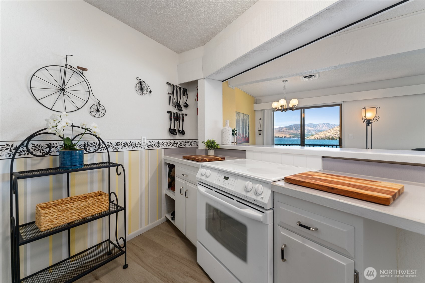 Kitchen view looking towards the glass sliding doors leading to the lake view deck.