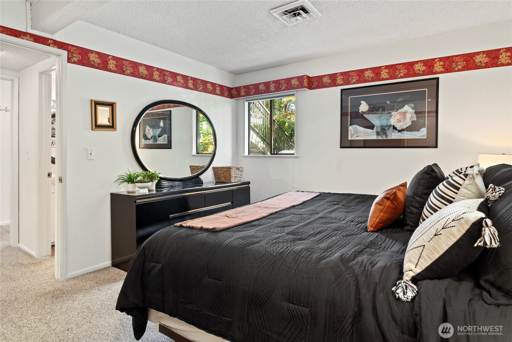 View 2 of spacious Primary Bedroom with King size bed.