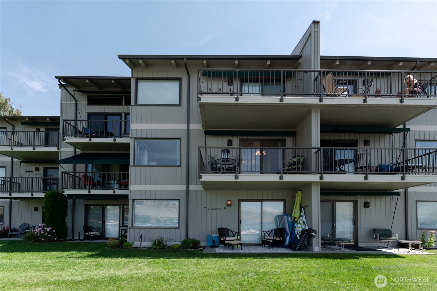 Exterior view of unit with large lake view deck.