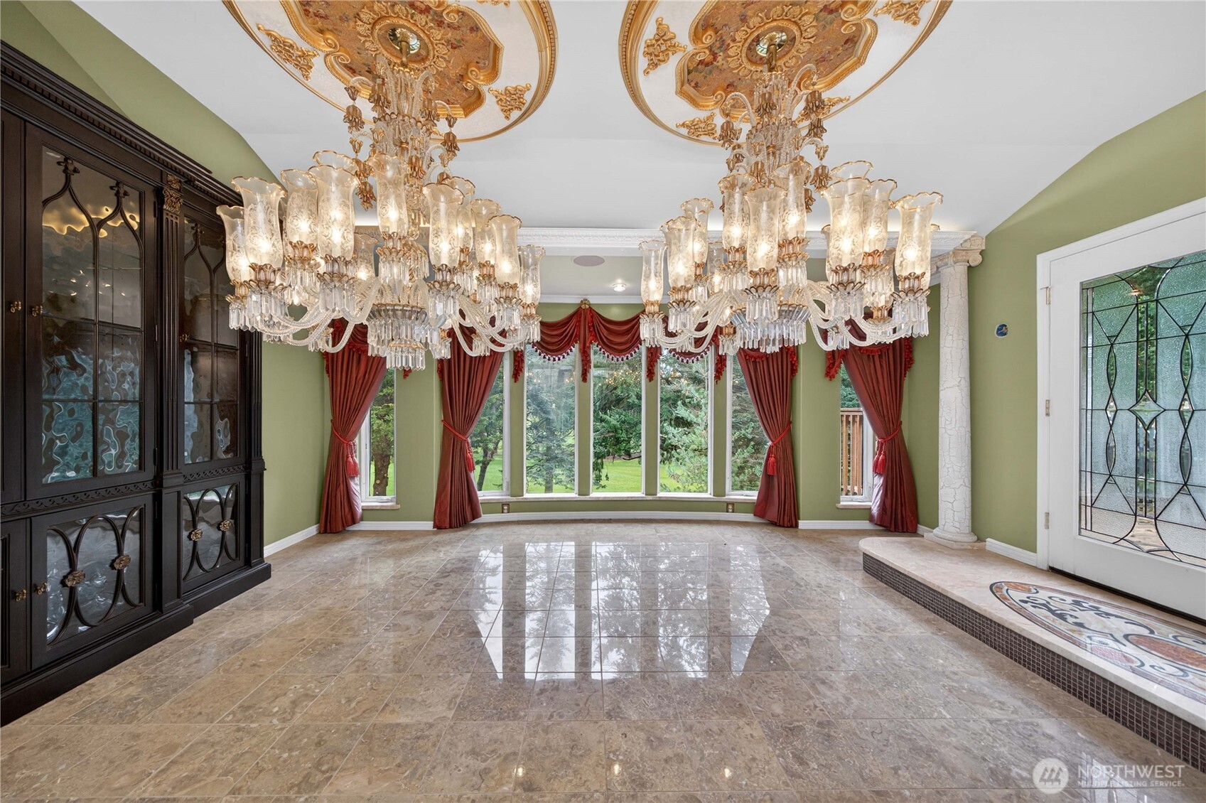 Elegant dining room with view of golf course.