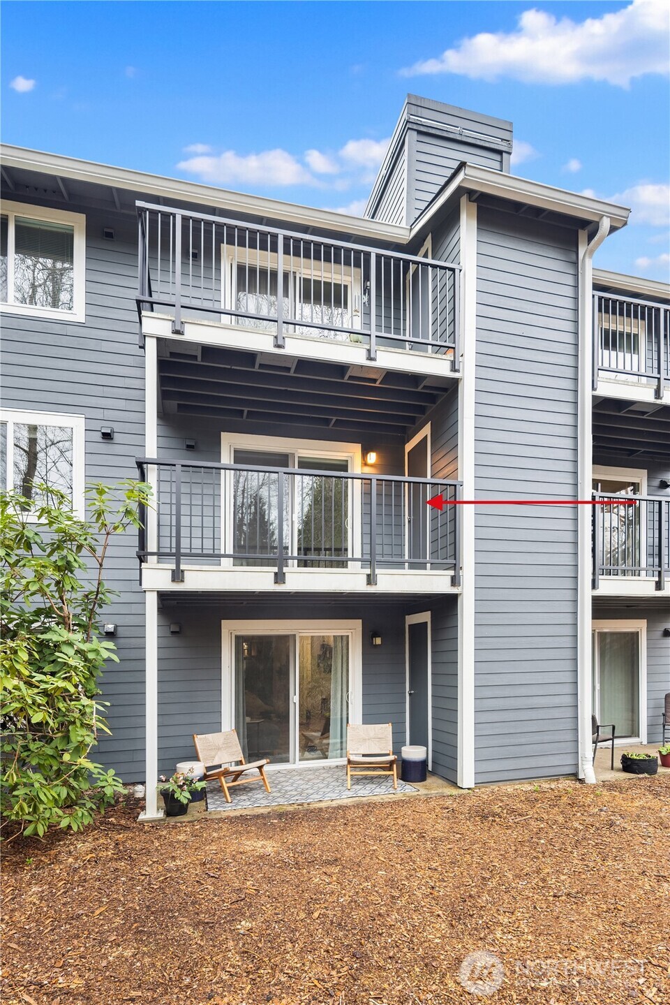 The second level terrace just off the living room overlooks a private preserved green belt.