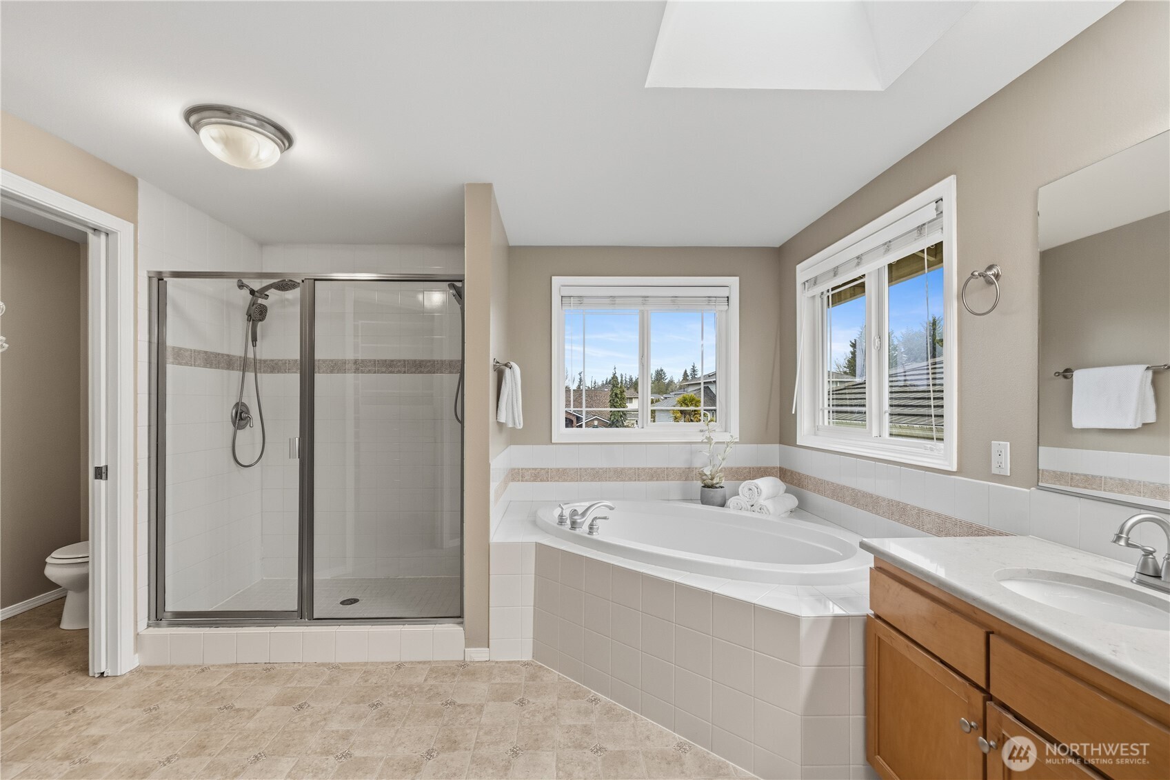 Luxurious primary suite features a five-piece bath and walk-in closet.