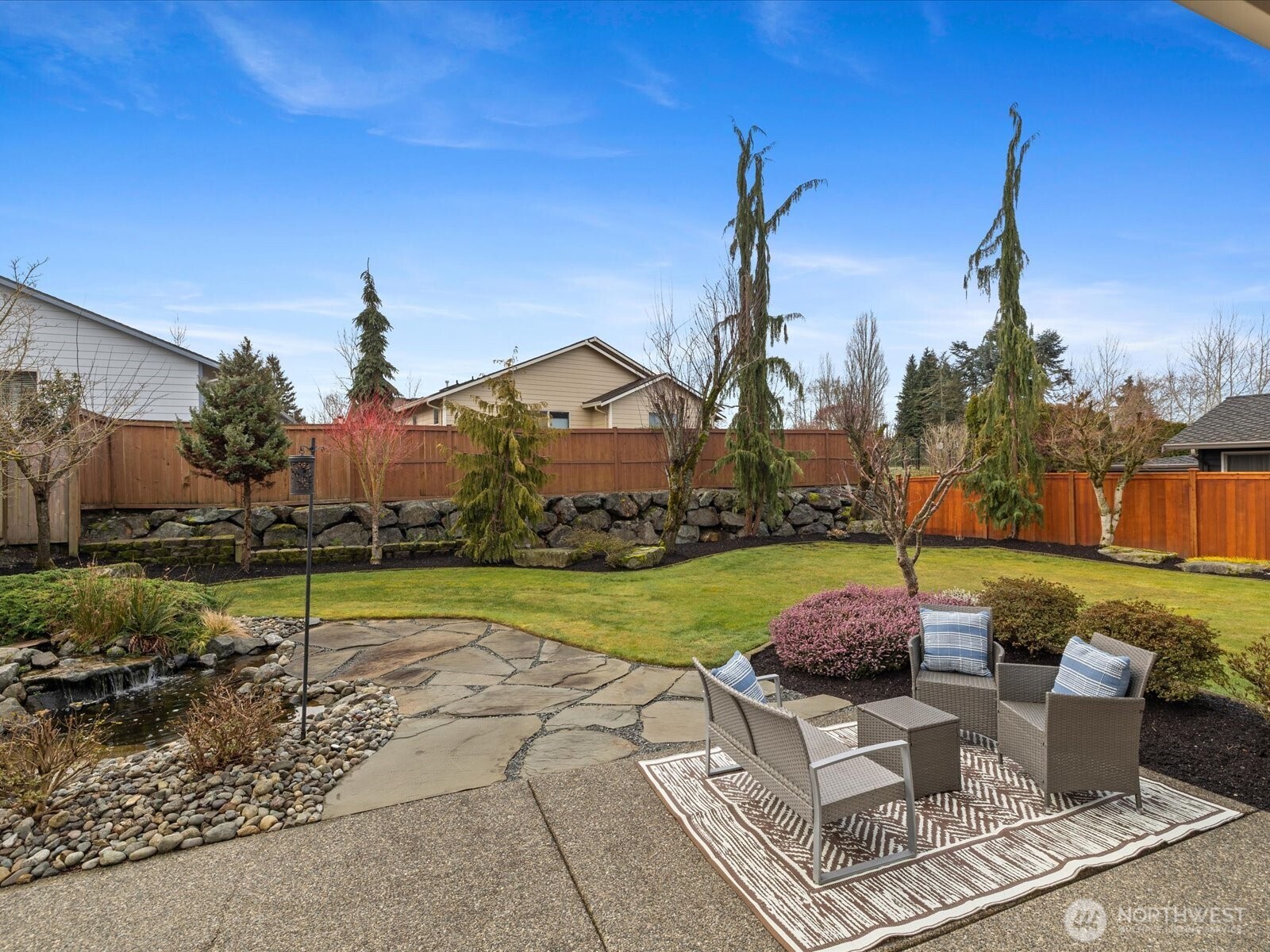 Huge three car garage with durable epoxy floors.