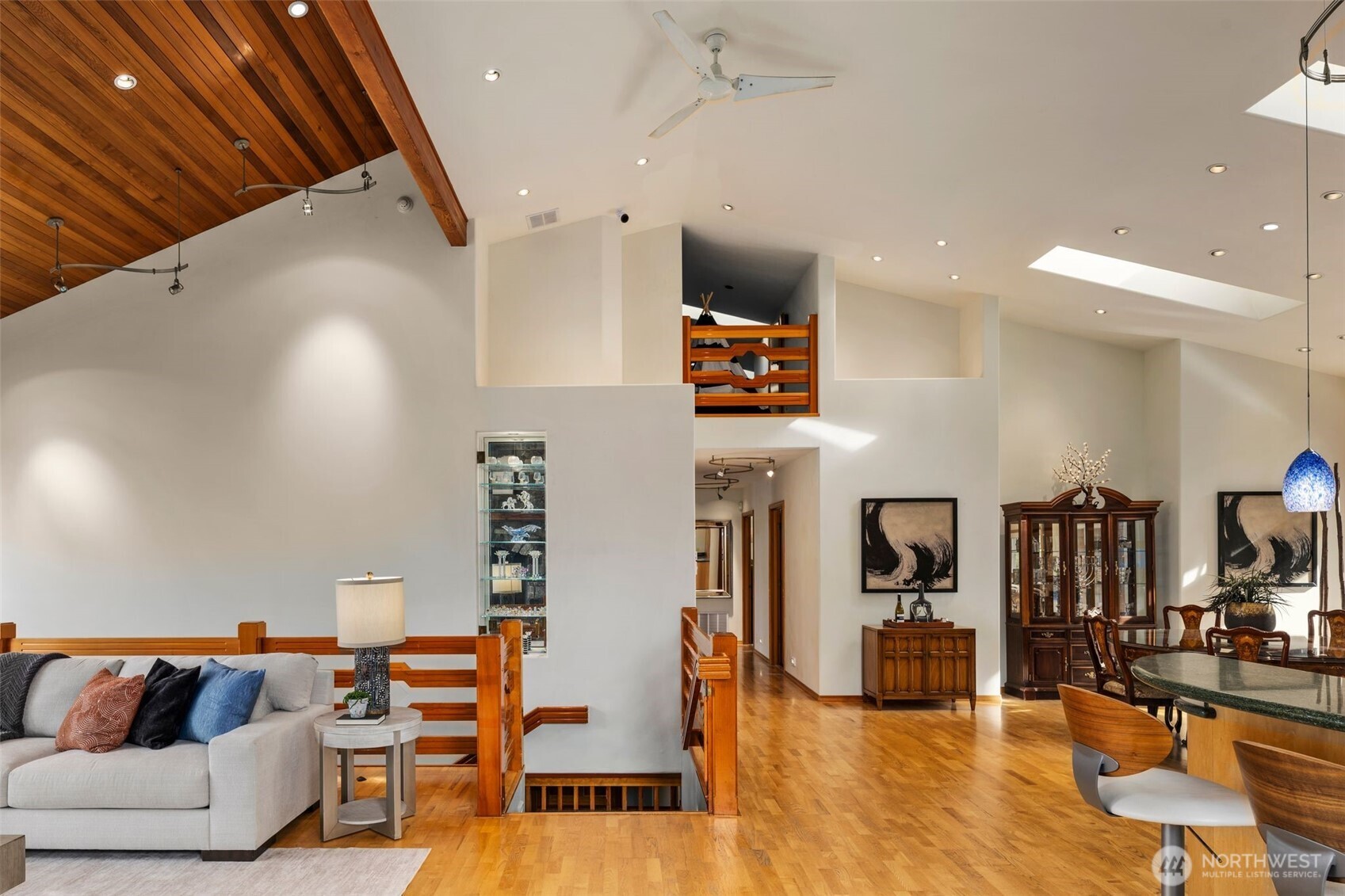 Peek a boo! Notice the loft attic space up top where there's more than 6ft of headroom. There's also many places to feature your artwork and collector items in this home. This is the view from the fireplace looking inward.
