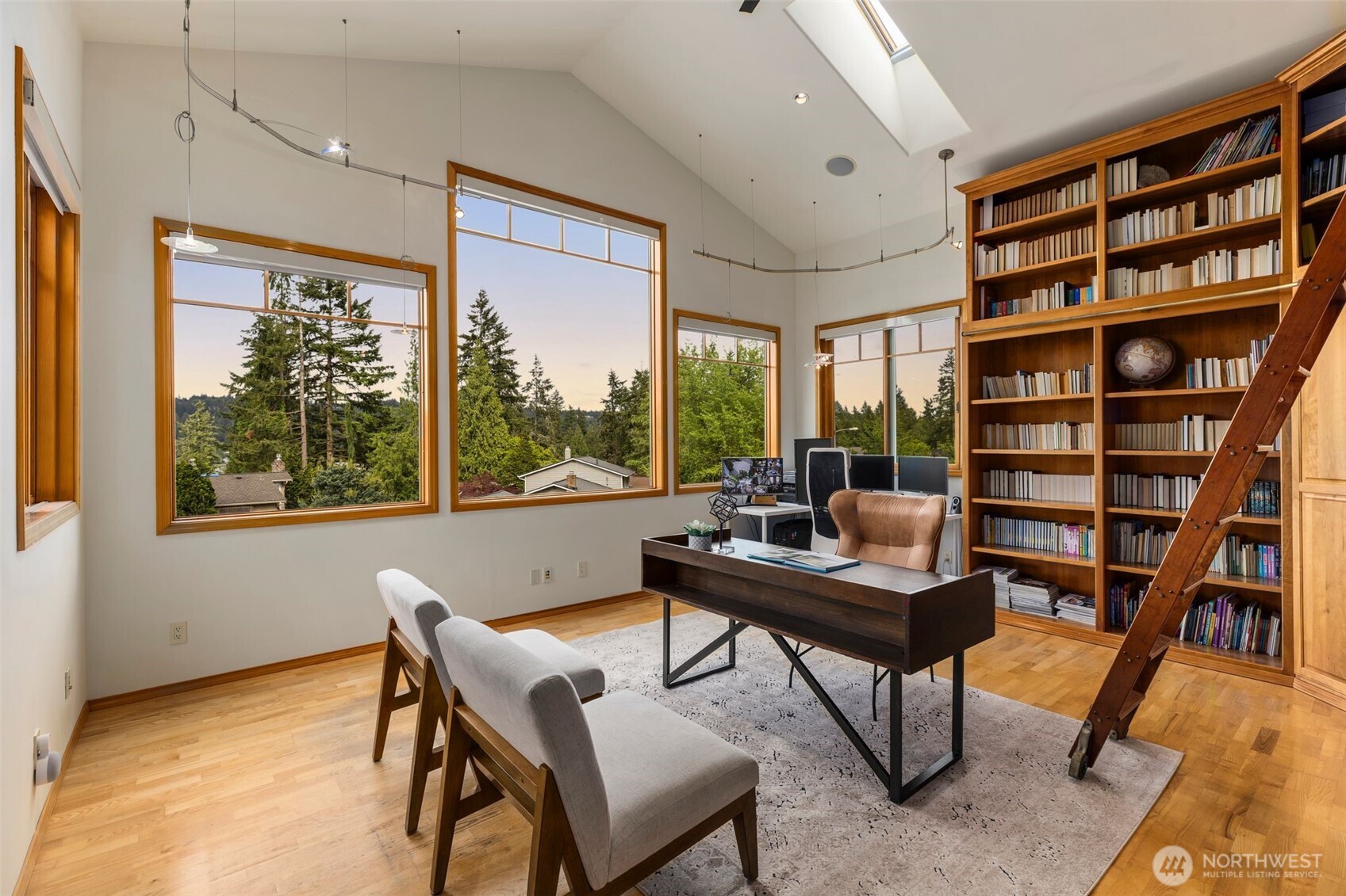 Highly understated in this photo, this office is massive, could fit several desks if you wanted. Skylights and tall windows pour light into this room daily...talk about a great Work From Home setup!!