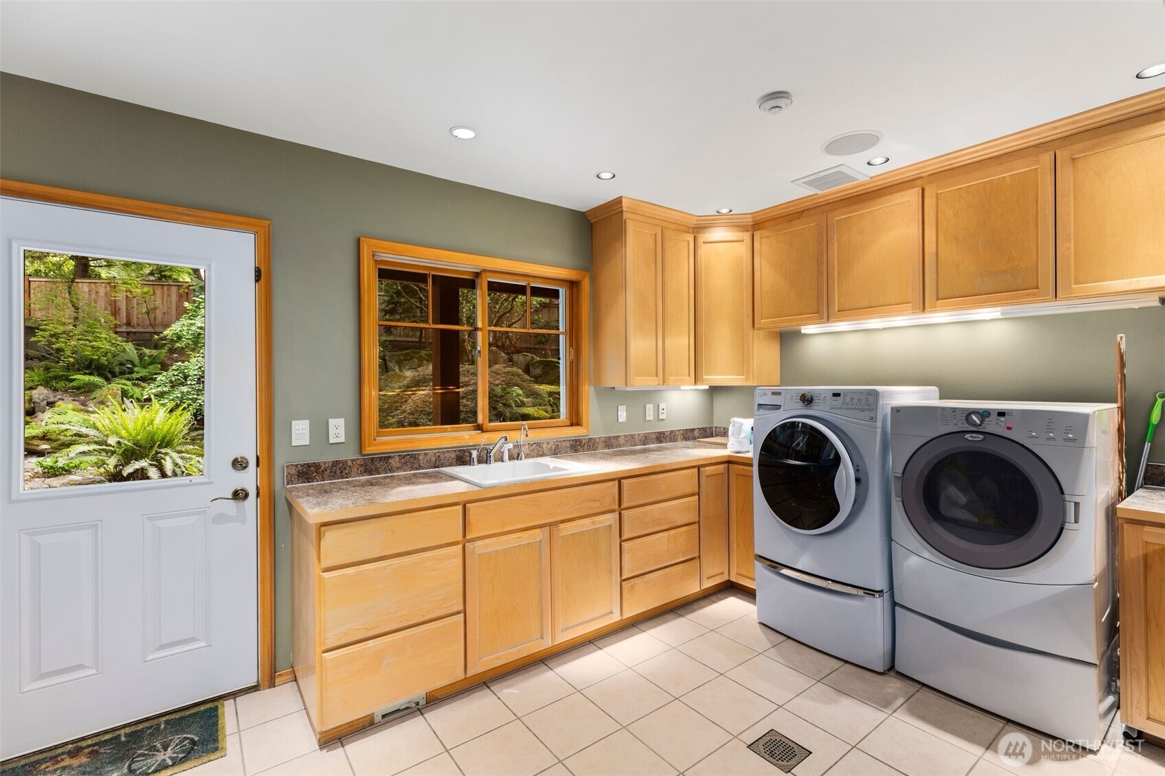 Huge laundry room and even has a shute from upstairs easily accessible.