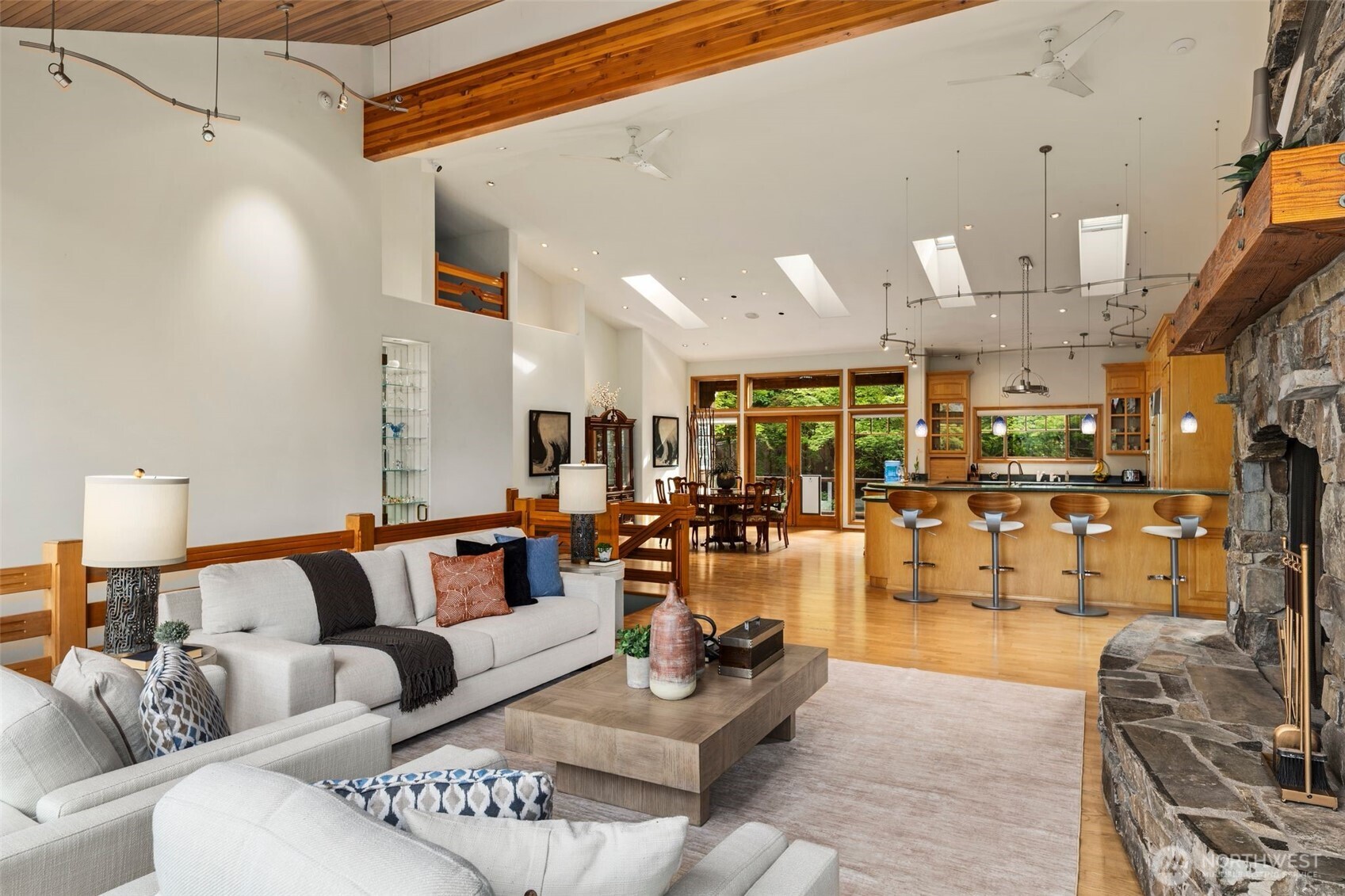 Keep your jaw together because this is truly amazing! Imagine sitting here every day enjoying a piece of NW architecture with 18ft ceilings and an extra large space to lounge in with a view.