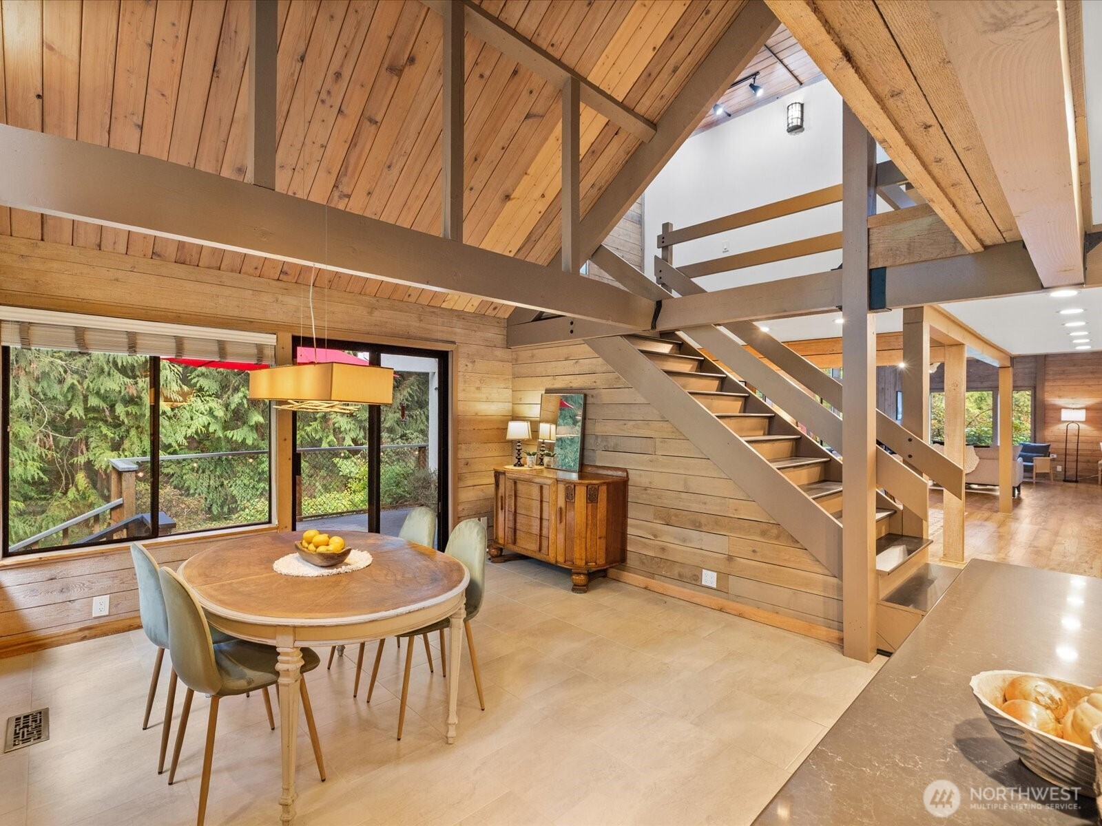 Eating space right off kitchen leads out to back deck that overlooks private quiet wooded back yard. Listen the creek while sipping your morning coffee.