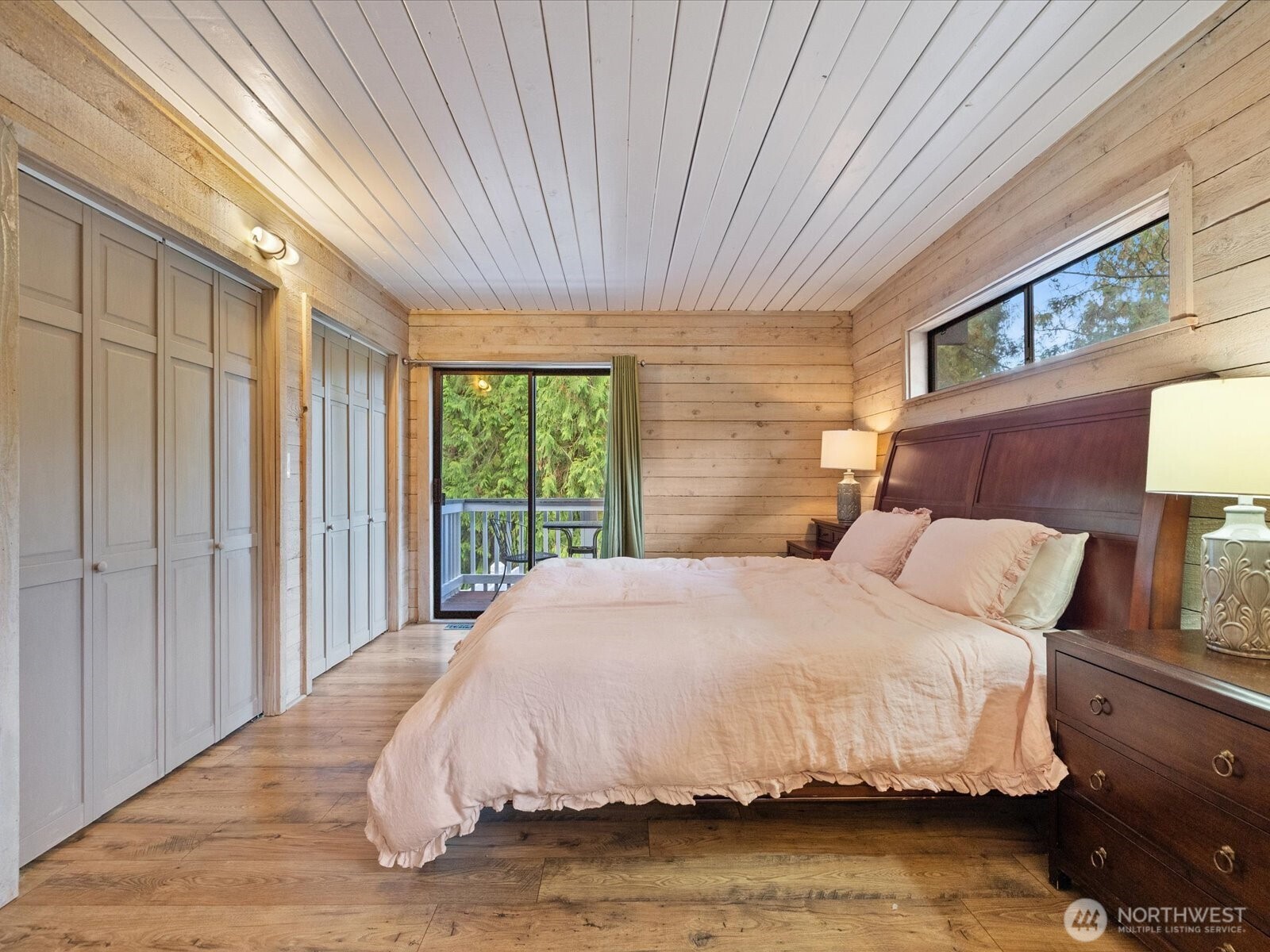 Primary bedroom features balcony.