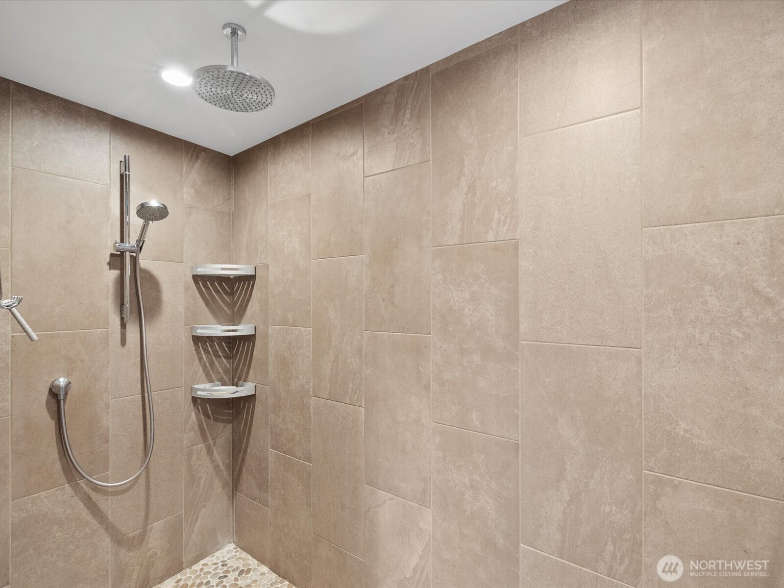 Oversized walk-in shower with rainfall showerhead