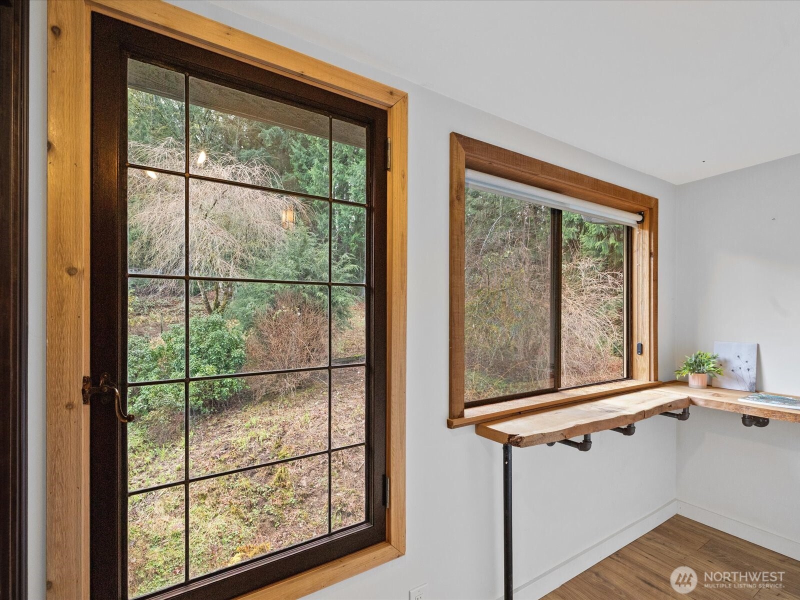 This is a great study, work from home space right next to built in shelving at end of hall on upper level.