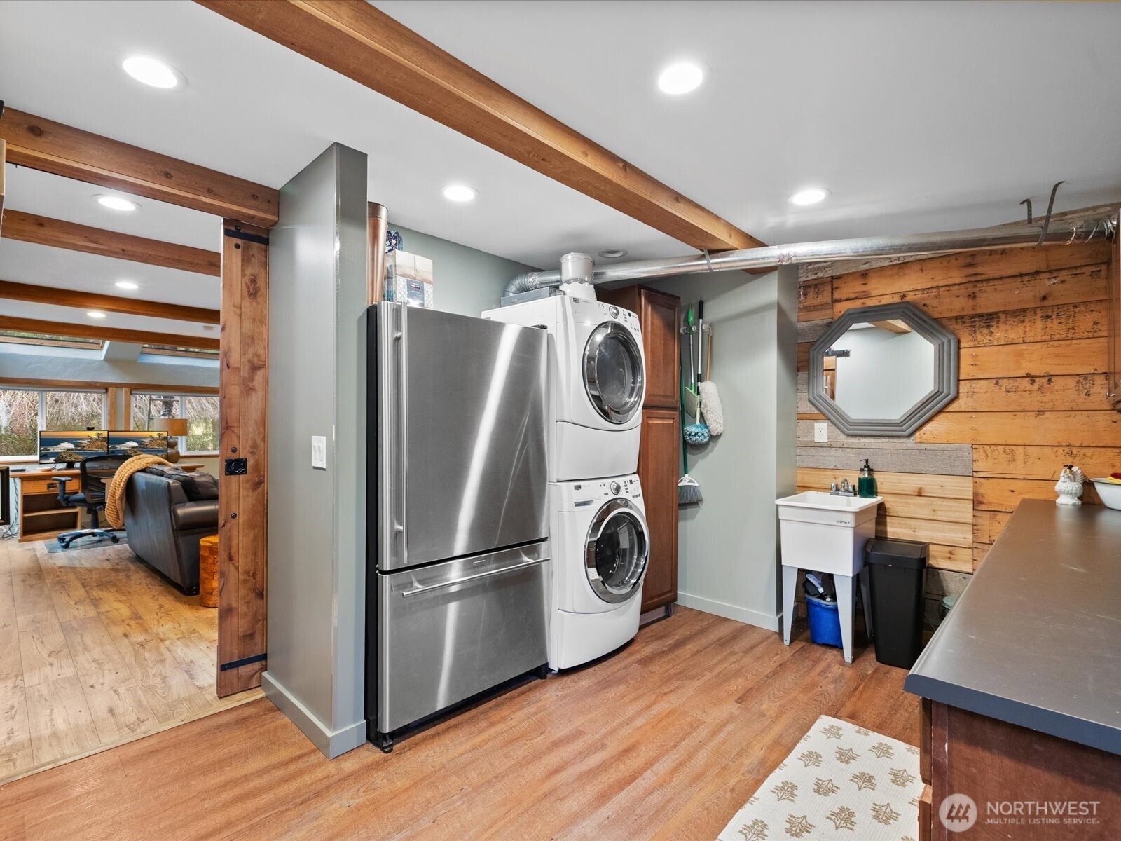 Mudroom complete with fridge, washer & dryer.
