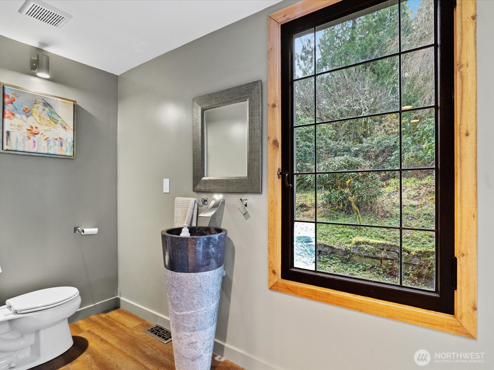 Lower powder room with historic oringal Seattle Times window.