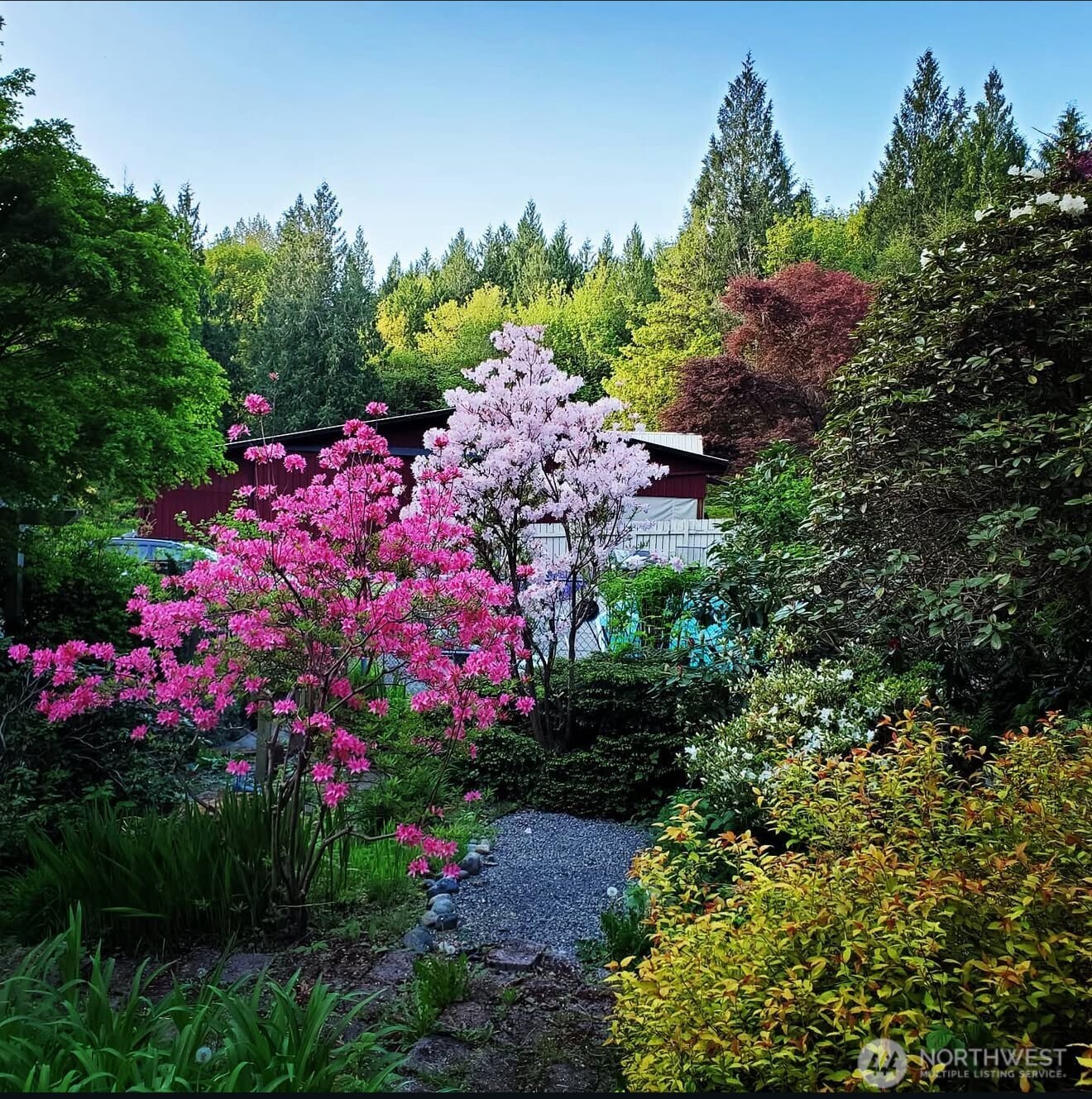 Grounds of property are full of azaleas, rhododendrons, fruit trees, raspberry & blueberry bushes.