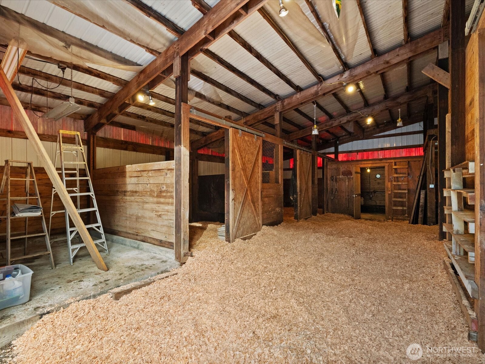 Washing station in barn to left, with full six stalls.