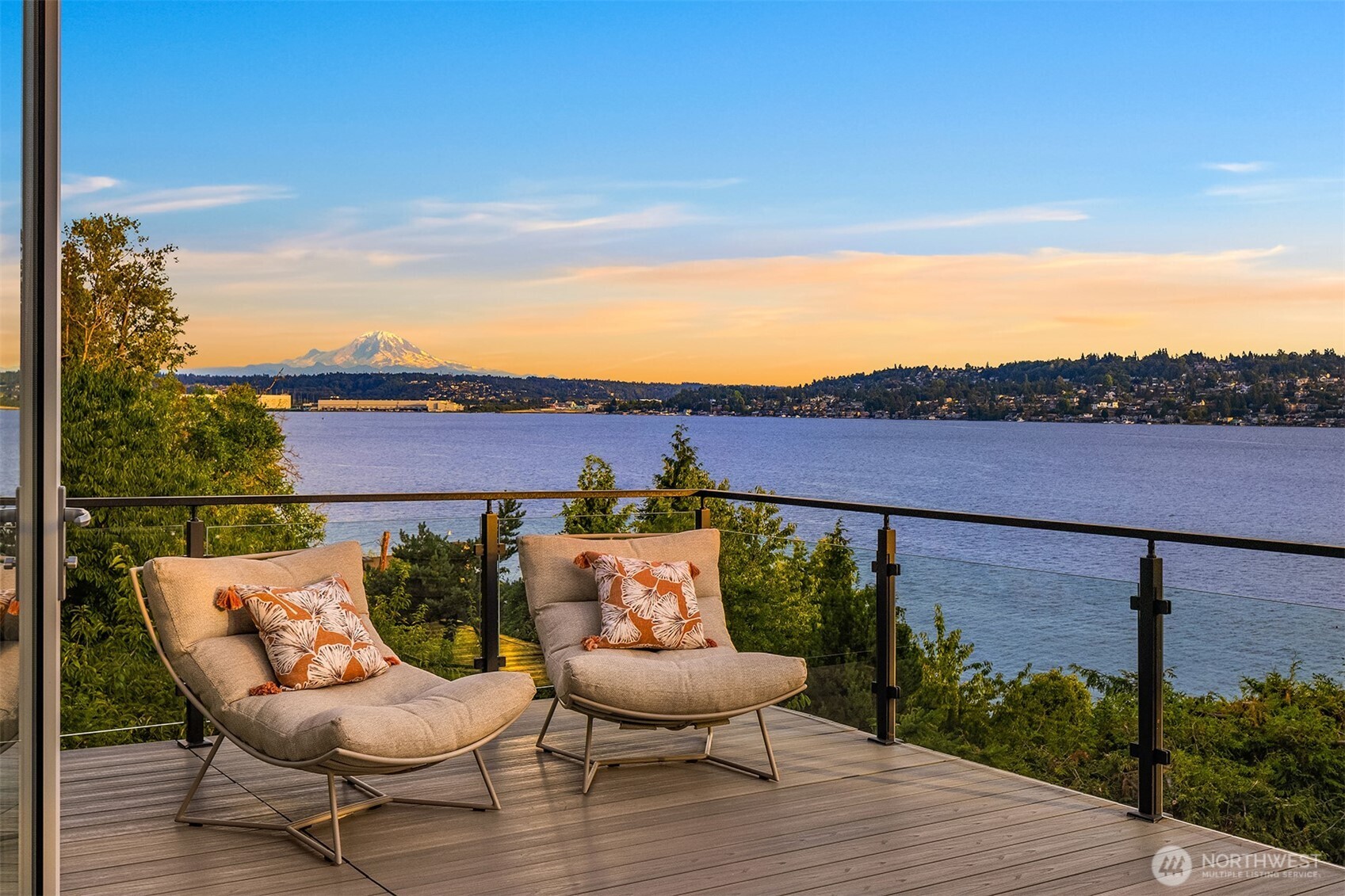 Private view deck off the primary suite, offering a front-row seat to sweeping Lake Washington vistas and the majesty of Mount Raineir