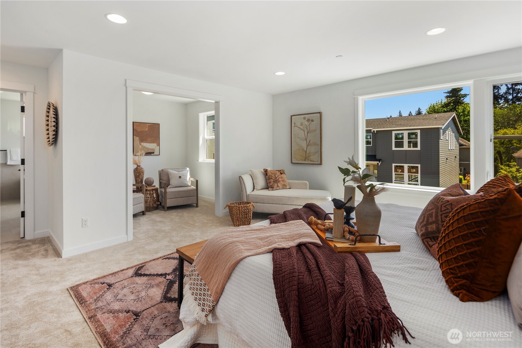 Primary Bedroom with Sitting Area: Designed for flexibility, the primary suite opens to a bright sitting nook that can serve as a private lounge, reading corner, or workspace. The seamless connection between spaces enhances both comfort and usability.  Staged photos are of the model home of the same floorplan within the Foxmoore community and are for visualization purposes only. Colors, finishes, and layout can and will vary.
