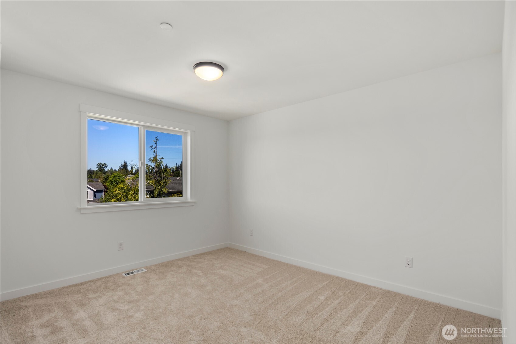 Secondary Bedroom: Spacious bedroom with plush carpet and a large window that brings in plenty of natural light. Neutral finishes provide a versatile setting ready for your personal touch.  Staged photos are of the model home of the same floorplan within the Foxmoore community and are for visualization purposes only. Colors, finishes, and layout can and will vary.