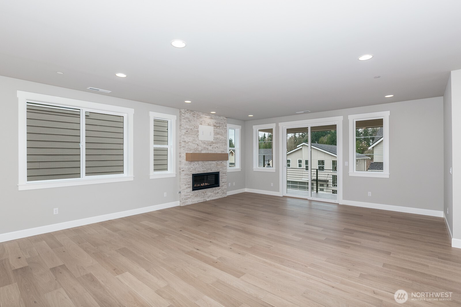 The main floor bedroom also makes a perfect home office/den located just off the Living room.  The West facing view captures sunsets and evergreen trees.