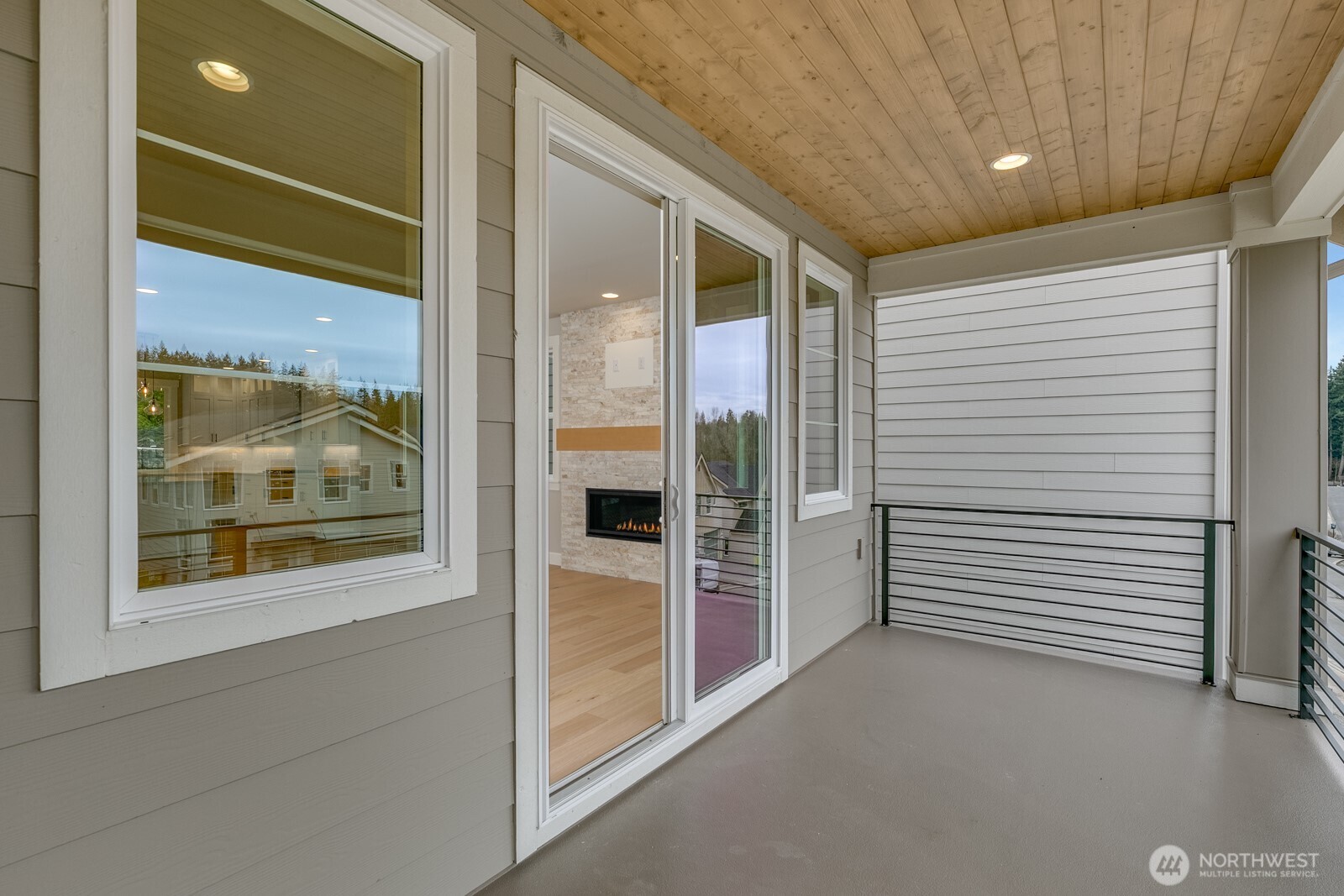 The upper floor loft offers relaxing views of nature and a perfect extra space for multiple uses from a media room to a home gym.