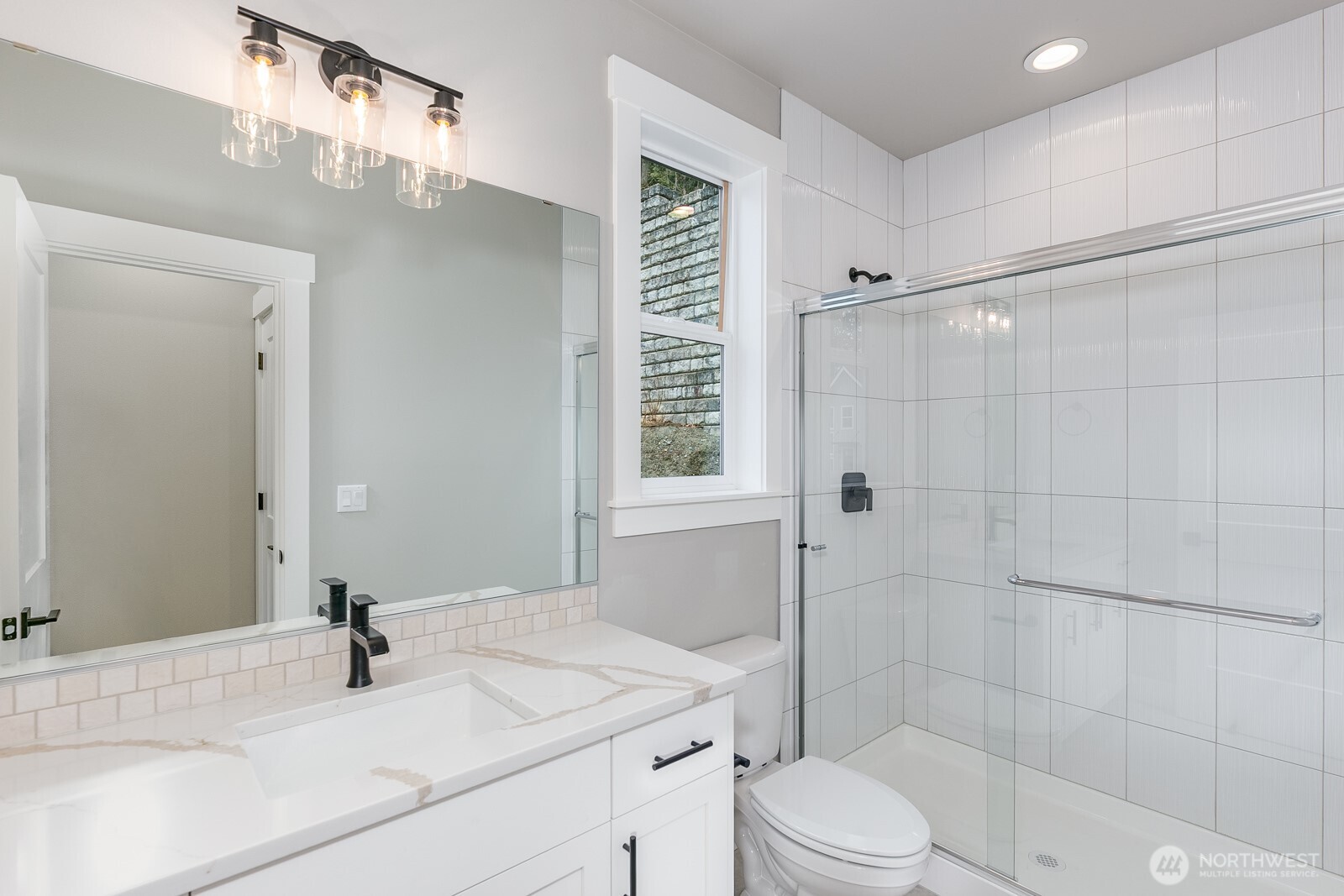 Luxury details abound in the Primary bathroom from the frameless shower to the deep soaking tub and extensive use of tile.