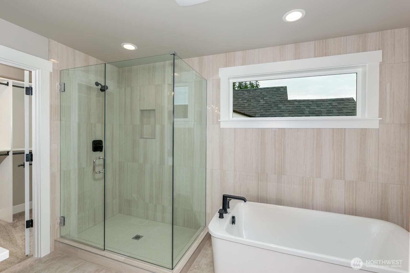 One of 3 upper bedrooms with a peaceful view of nature bordering a green space.