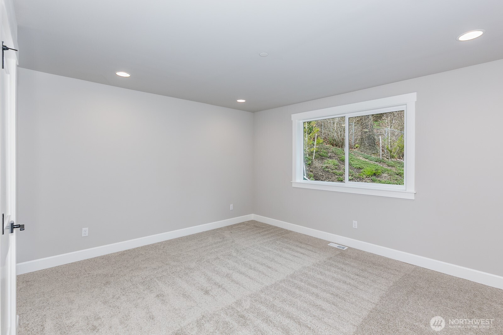 The ultimate laundry room offers a sink, quartz countertop, tile floor and 2 sets of cabinets for storage.