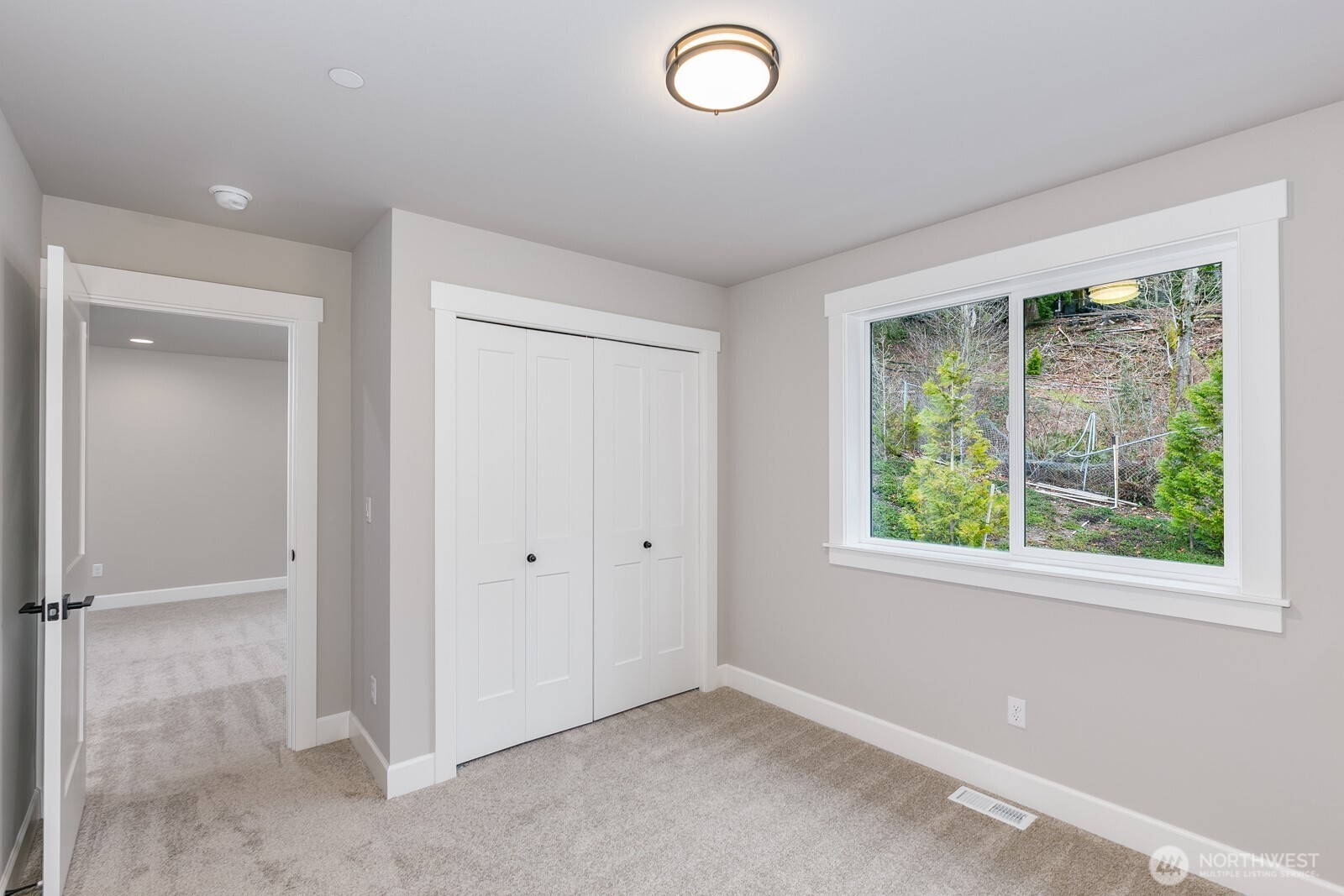 Welcoming entry with hardwood floors leads to a Jr Ensuite/Bonus room down the hall.