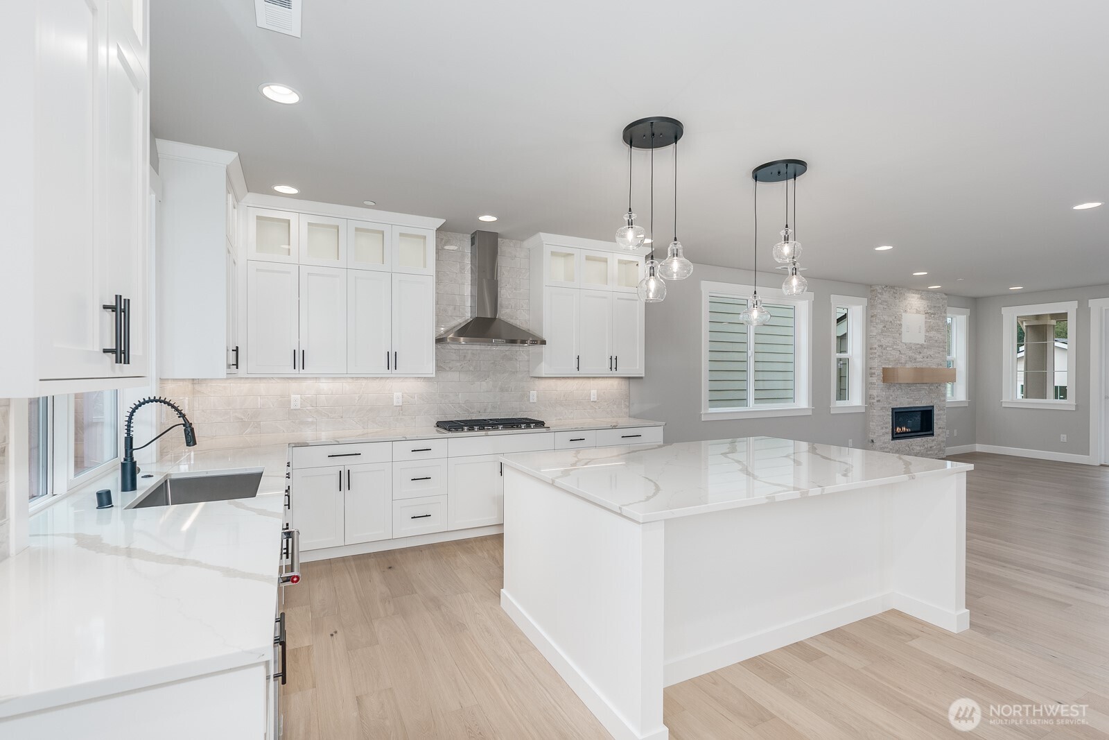 Oversized gas fireplace and extensive hardwood floors