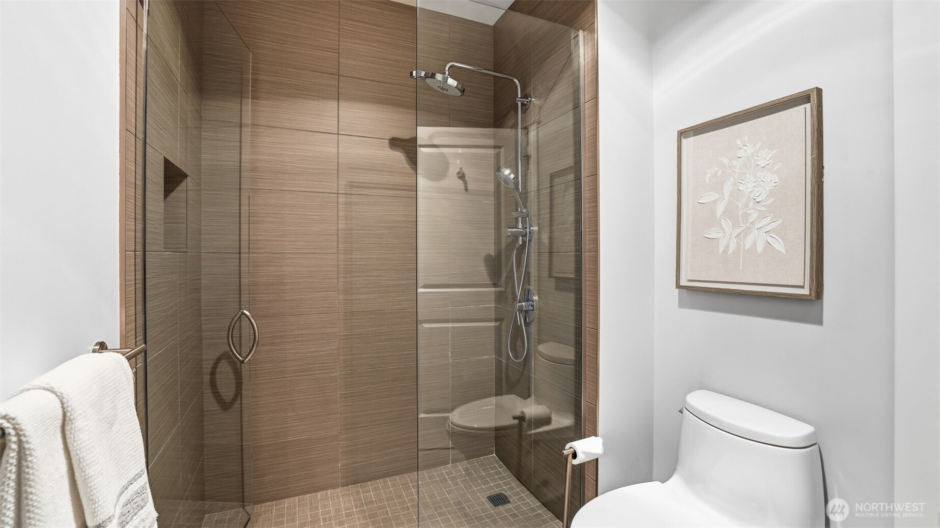 Primary suite attached bath with frameless walk-in shower
