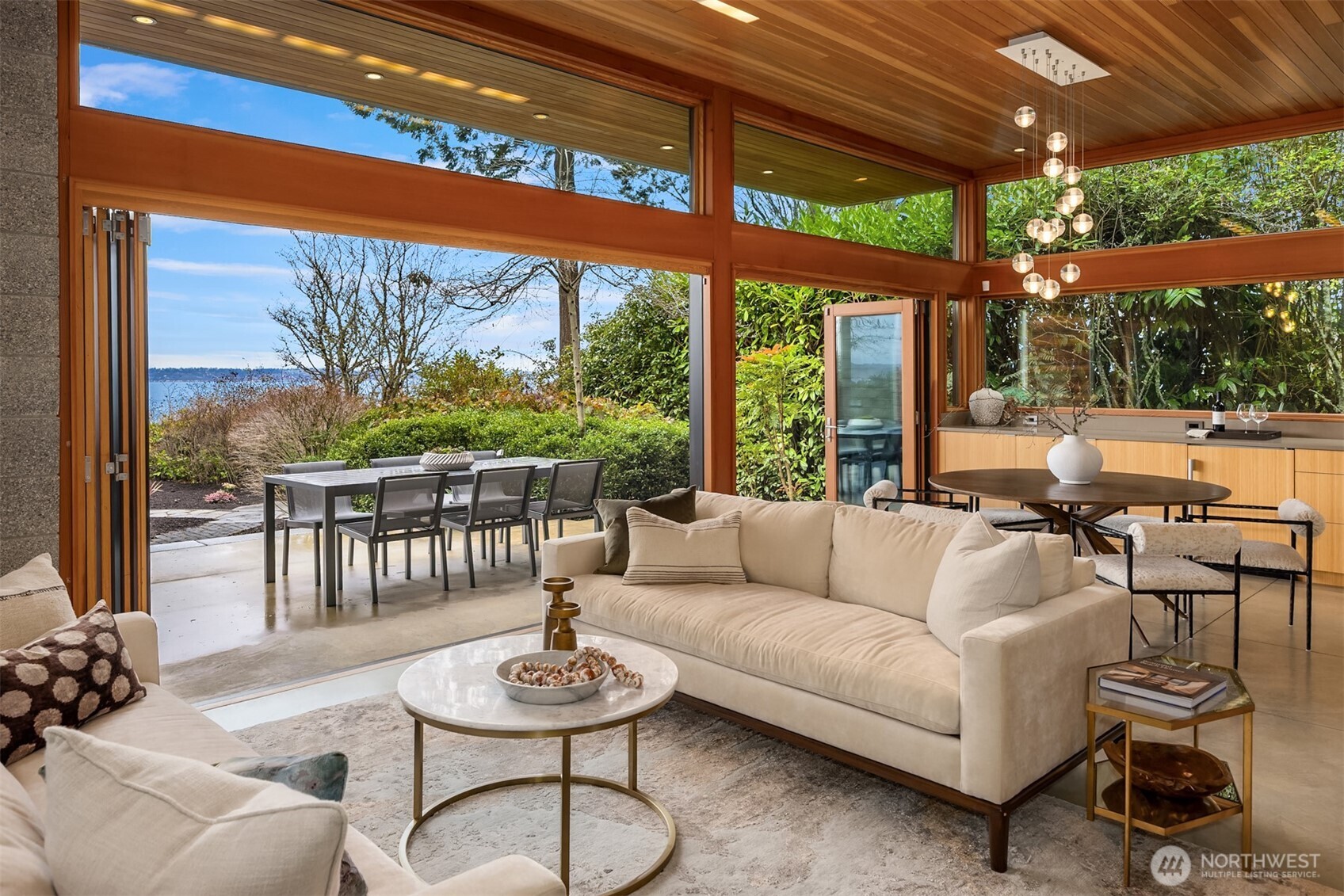 Main house living room with folding glass wall