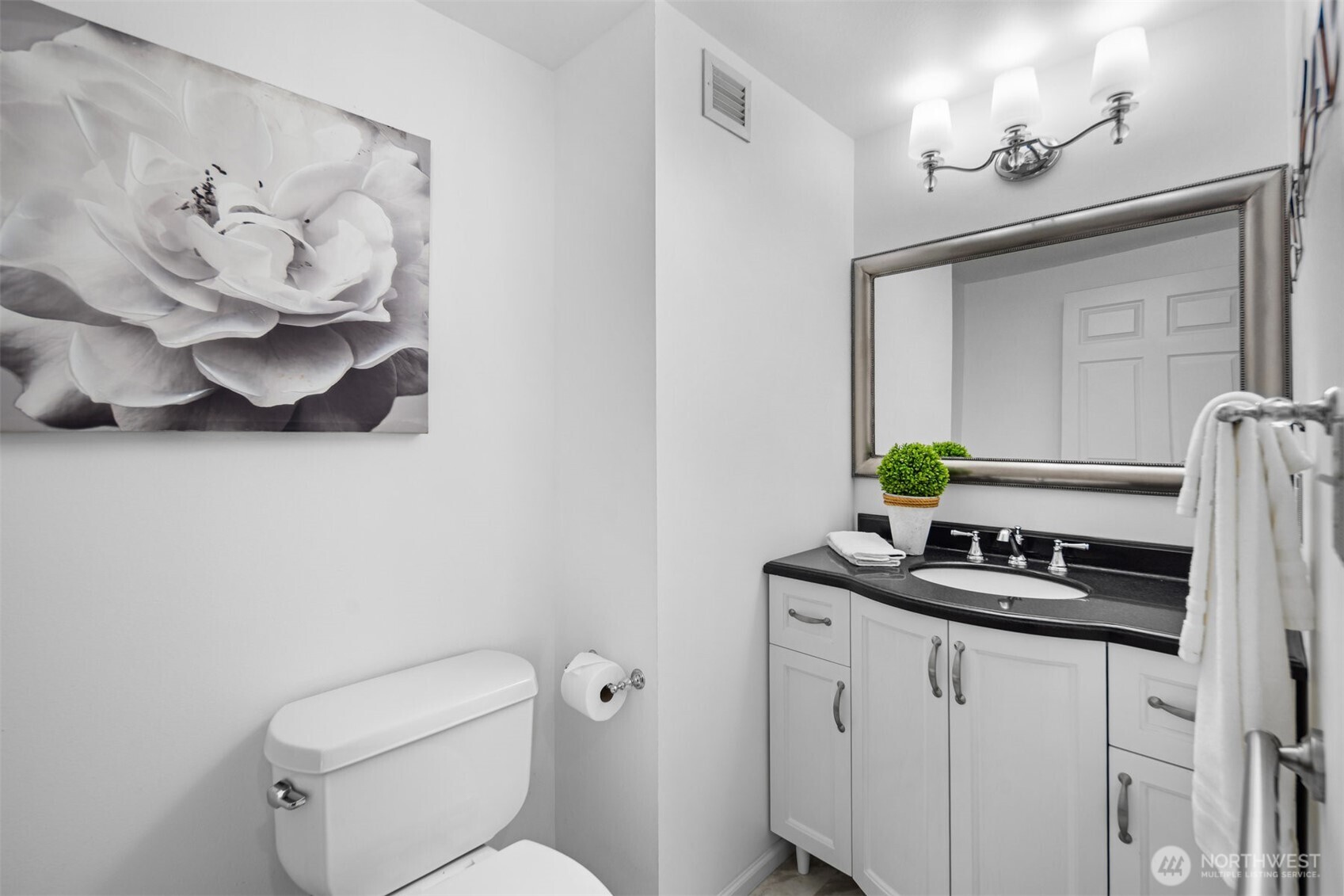 Guest powder room providing added convenience for everyday living and entertaining.