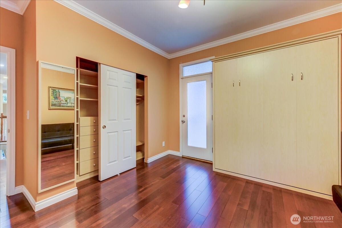 Bedroom 3 California Closet and door to deck