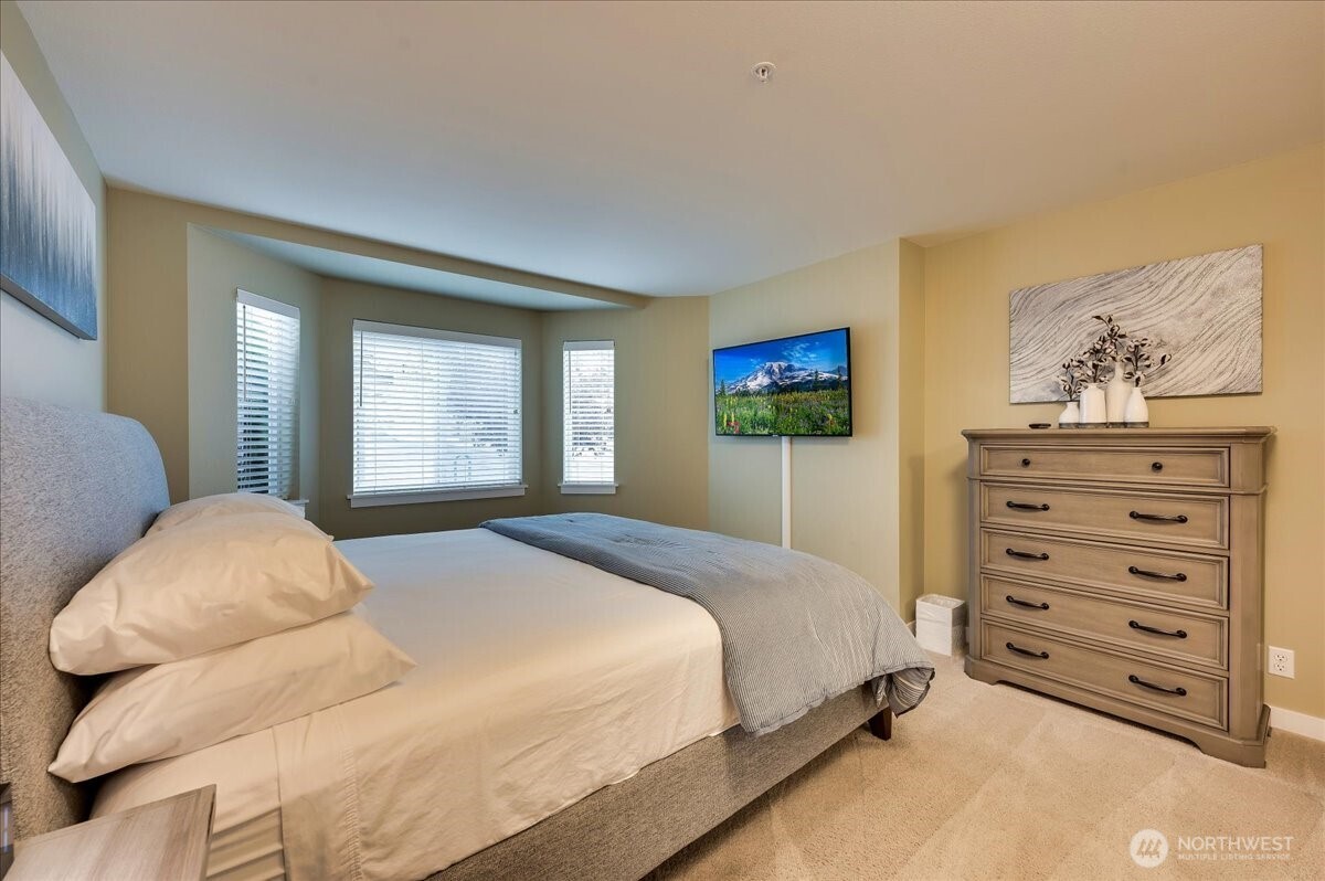 Primary Bedroom, bed and picture above do not convey.