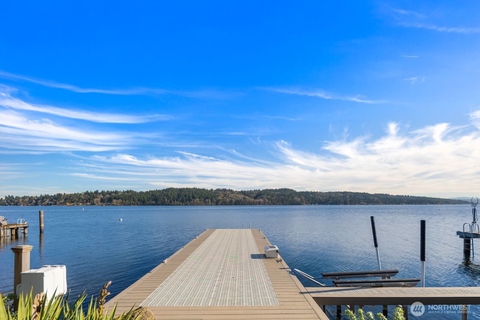 Home faces nothing but trees, mountain and sky across from St. Edward's Park